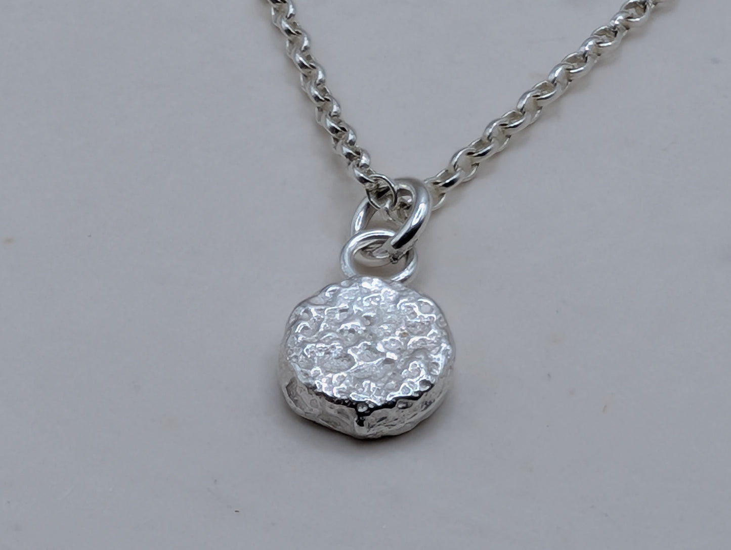 Sandcast disc necklace